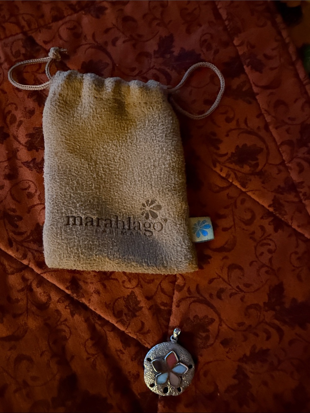 “Marahlago” Sterling Sand Dollar Pendant With Pouch.